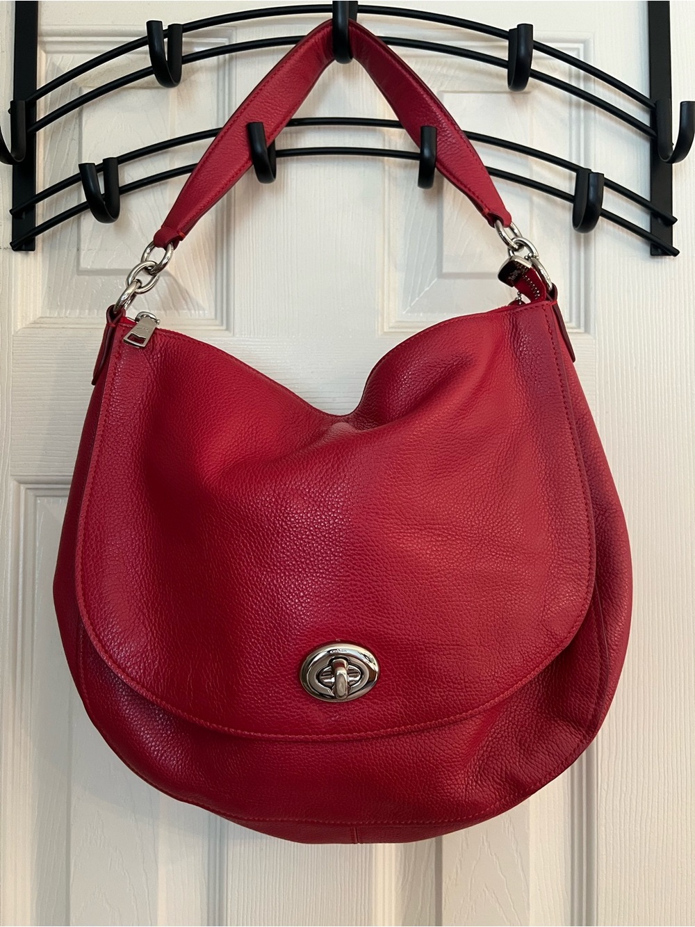 Coach turn lock hobo red polished pebble front